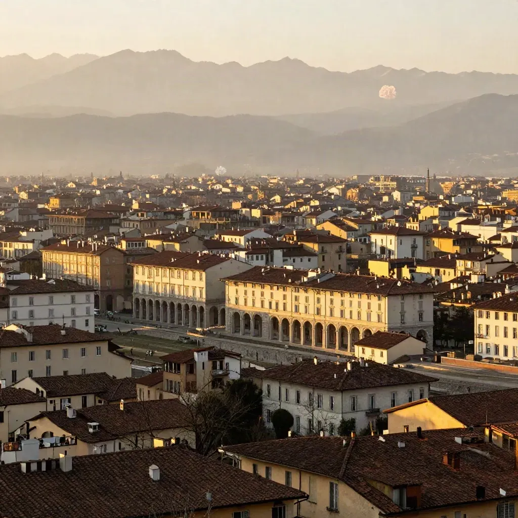 Torino all’alba con arcate, tetti in cotto e Alpi sfumate nella foschia
